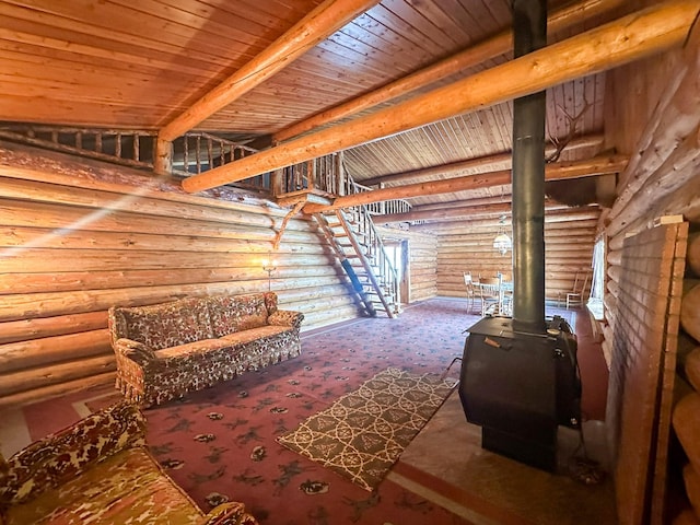 68 River Dr, Cascade, MT 59421 - carpeted living room featuring log walls, wood ceiling, and a wood stove