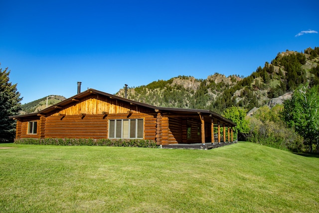 68 River Dr, Cascade, MT 59421 - view of property exterior featuring log siding, a yard, and a mountain view