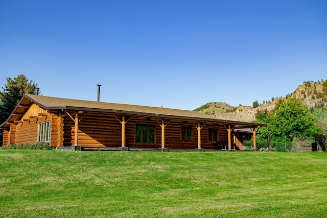 68 River Dr, Cascade, MT 59421 - rear view of property featuring log exterior, a mountain view, and a yard
