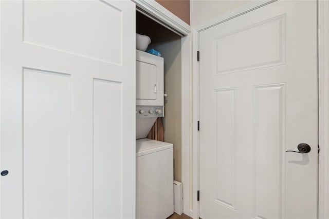 laundry room featuring stacked washing maching and dryer