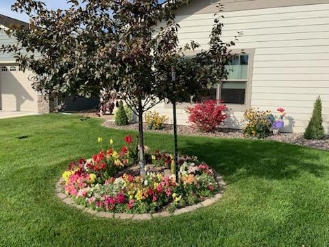 view of yard featuring a garage