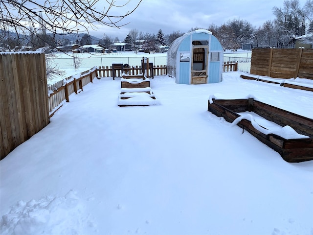 view of yard covered in snow