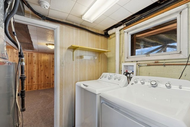 185 Veteran Dr, Columbia Falls, MT 59912 - washroom featuring laundry area, washing machine and clothes dryer, wooden walls, and carpet