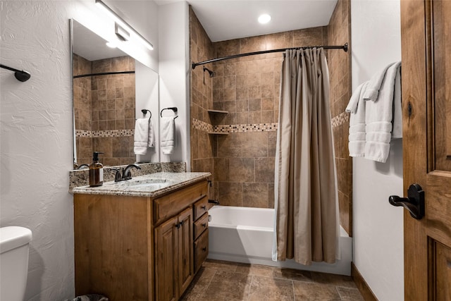 full bathroom with shower / tub combo, vanity, and toilet