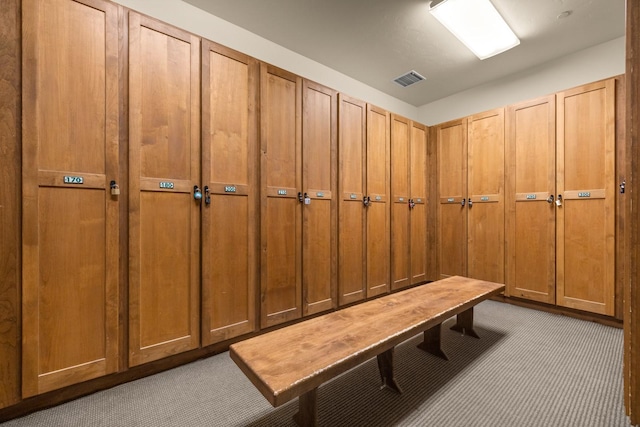 mudroom featuring light colored carpet