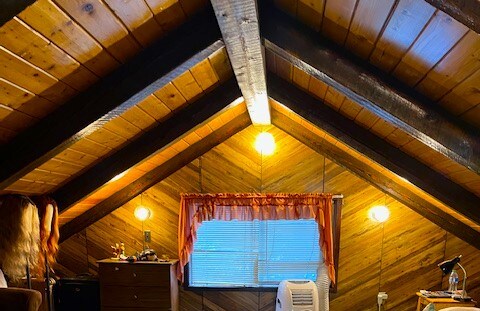 living room with dark hardwood / wood-style floors and a textured ceiling