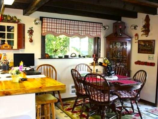 dining room with beam ceiling