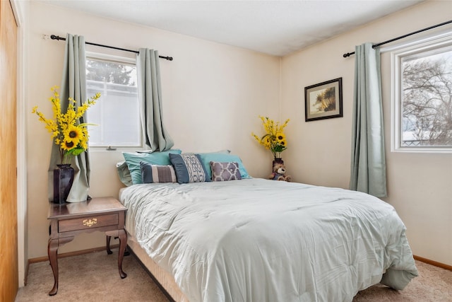 bedroom with light carpet