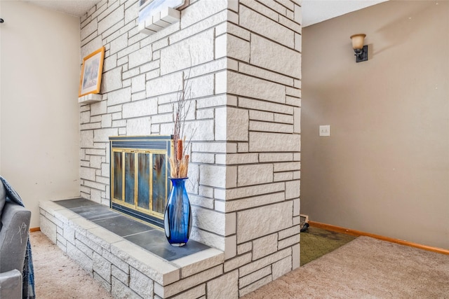 details featuring a stone fireplace and carpet floors