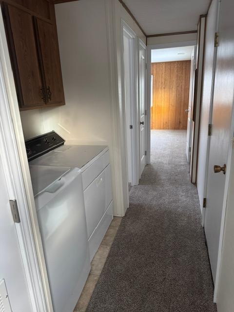 1730 N Hannaford St, Helena, MT 59601 - hall featuring light carpet, washer and dryer, and wooden walls