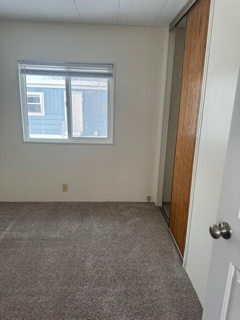 1730 N Hannaford St, Helena, MT 59601 - spare room with carpet