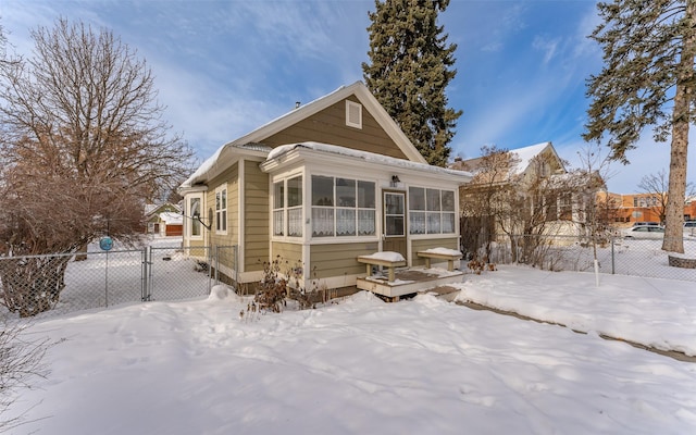 view of front of property featuring a sunroom