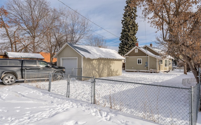 exterior space with a garage and an outdoor structure