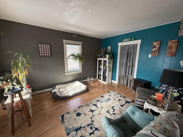 living room with hardwood / wood-style floors and a textured ceiling