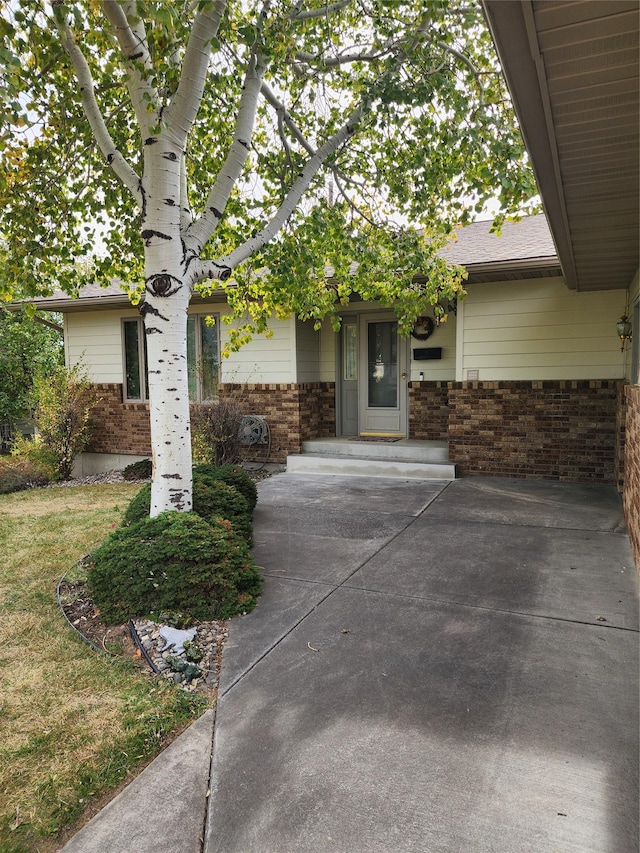 116 29th Ave NE, Great Falls, MT 59404 - view of exterior entry featuring brick siding