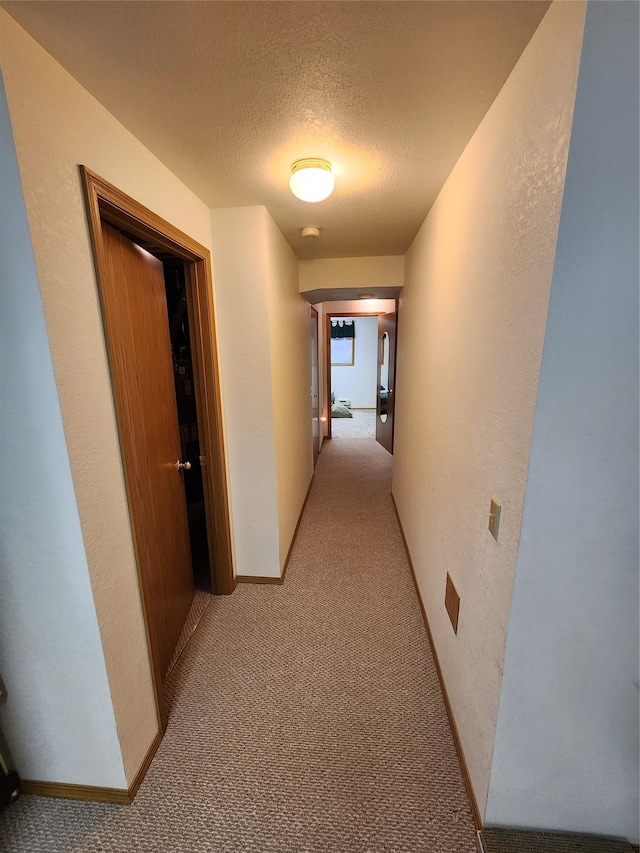 116 29th Ave NE, Great Falls, MT 59404 - corridor featuring light carpet, a textured ceiling, and a textured wall