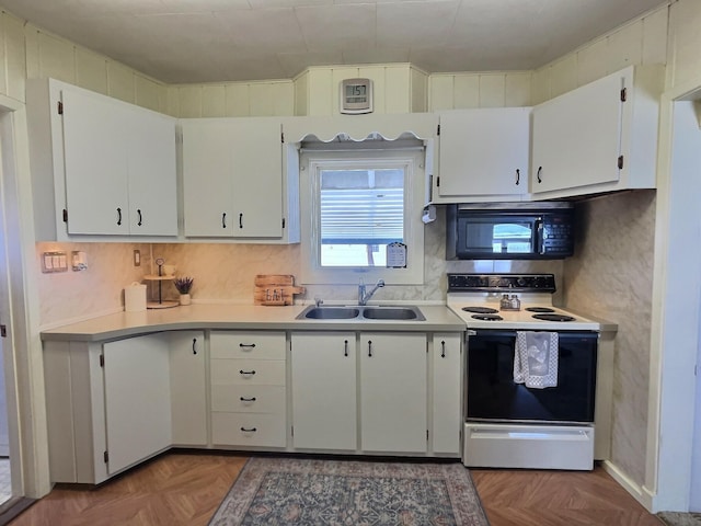 kitchen featuring sink, dark parquet flooring, white electric stove, and white cabinets