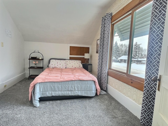 bedroom with vaulted ceiling and carpet