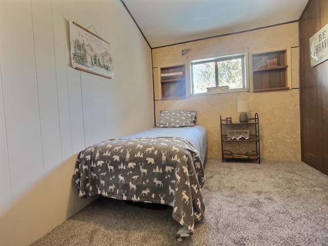 bedroom featuring crown molding and carpet flooring