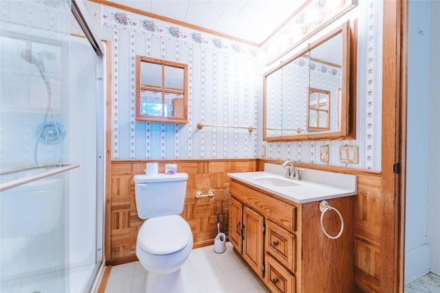 bathroom featuring vanity, an enclosed shower, crown molding, and toilet