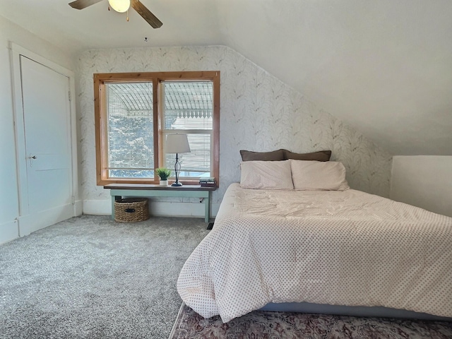 carpeted bedroom with vaulted ceiling and ceiling fan