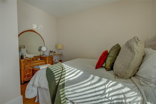 bedroom with wood finished floors