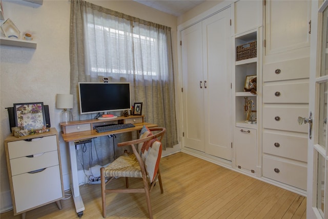 office area with light wood-style floors
