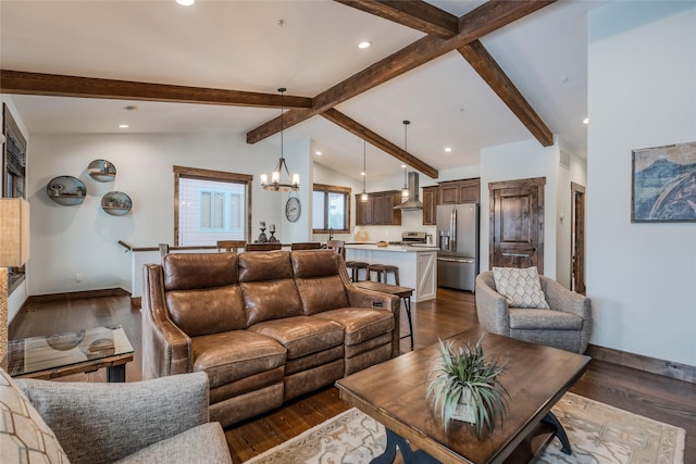 living room with a chandelier, lofted ceiling with beams, dark wood-type flooring, and baseboards