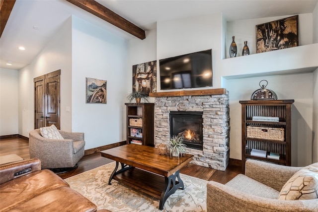 living room with baseboards, wood finished floors, a fireplace, and recessed lighting
