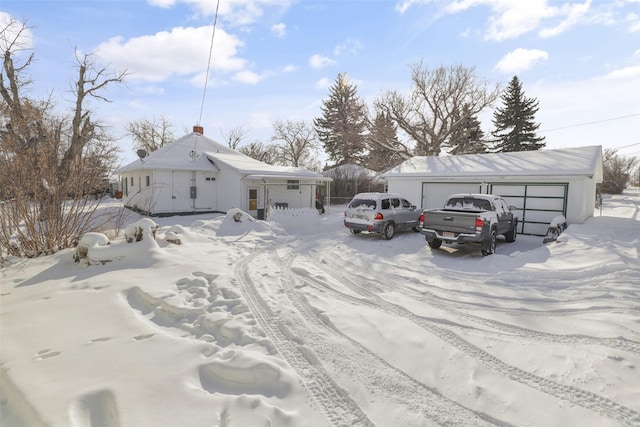 view of front of home with an outbuilding and a garage