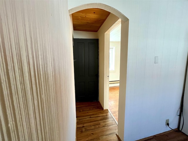 hallway with hardwood / wood-style flooring