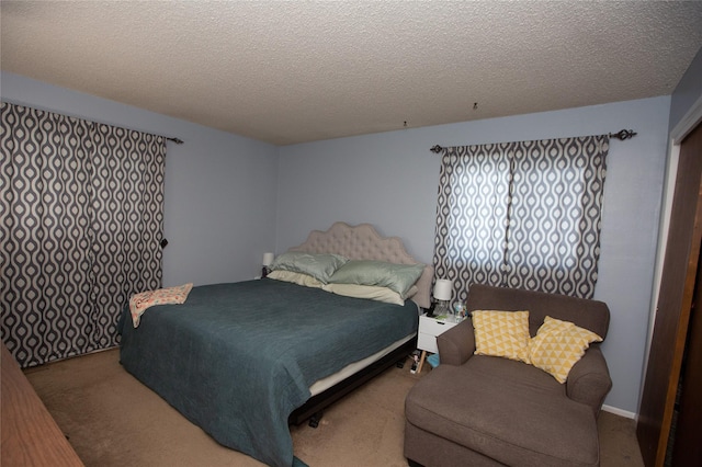 carpeted bedroom with a textured ceiling