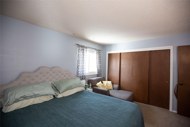 carpeted bedroom with a textured ceiling