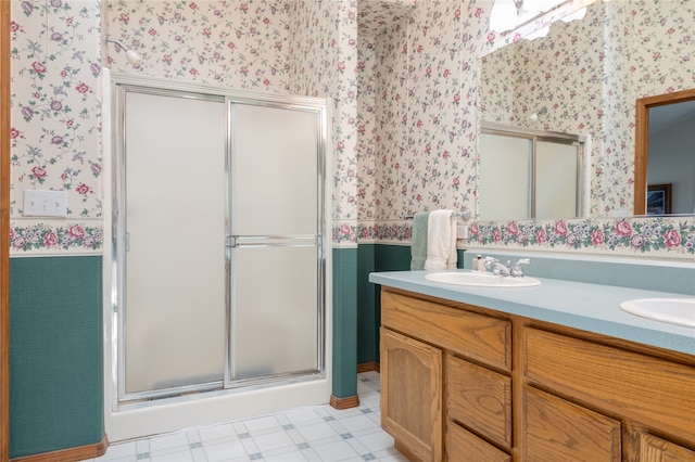 bathroom with vanity and an enclosed shower