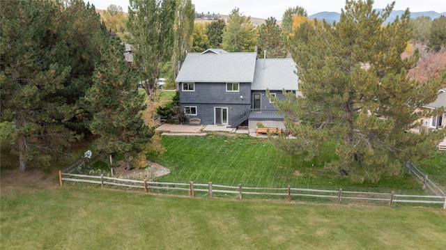 drone / aerial view with a mountain view and a rural view