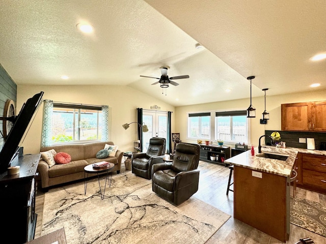 66 Moccasin Ln, Thompson Falls, MT 59873 - living area with a textured ceiling, light wood-style flooring, ceiling fan, vaulted ceiling, and recessed lighting