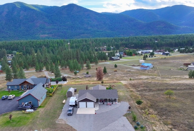 66 Moccasin Ln, Thompson Falls, MT 59873 - view of subject property featuring mountains and a heavily wooded area