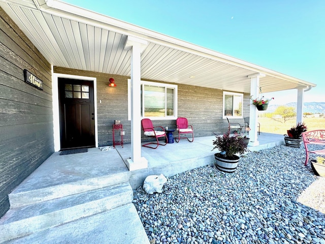 66 Moccasin Ln, Thompson Falls, MT 59873 - doorway to property featuring a porch
