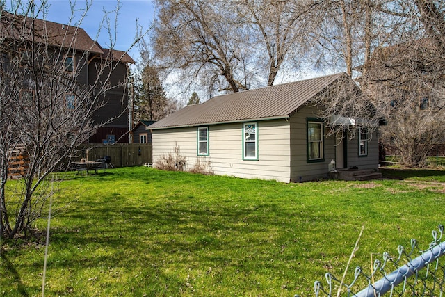 view of home's exterior featuring a lawn