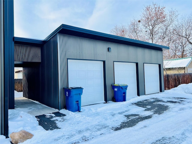 view of snow covered garage