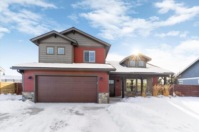 craftsman house with a garage and covered porch