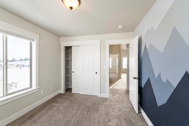 bedroom with a closet and carpet flooring