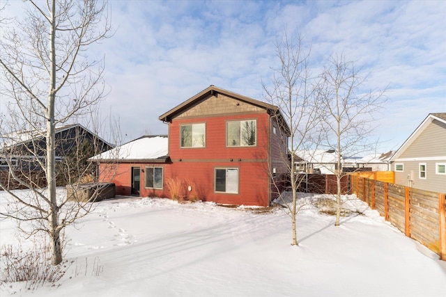 view of snow covered house