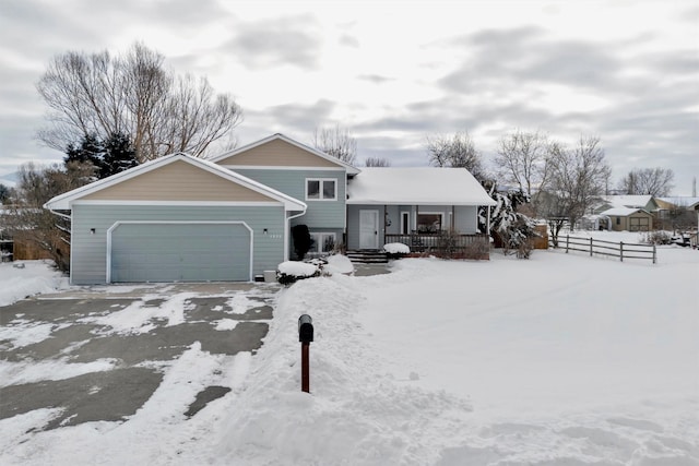 view of front facade with a garage and a porch