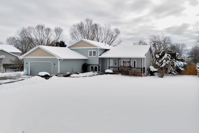 view of front of house featuring a garage and covered porch