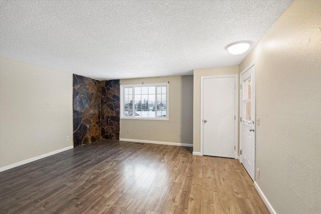 6 Parkway Dr Unit A & B, Kalispell, MT 59901 - empty room with a textured ceiling and wood finished floors