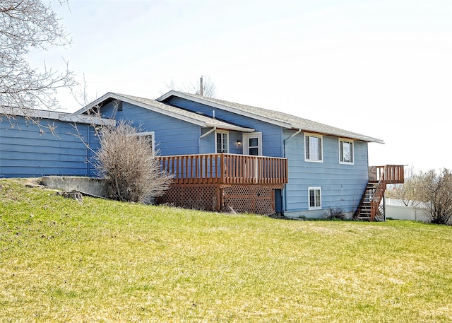 6 Parkway Dr Unit A & B, Kalispell, MT 59901 - rear view of property with a wooden deck, a yard, and stairway