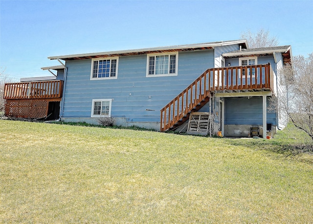 6 Parkway Dr Unit A & B, Kalispell, MT 59901 - rear view of property with a wooden deck, stairway, and a lawn