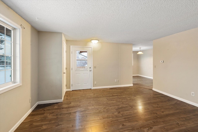 6 Parkway Dr Unit A & B, Kalispell, MT 59901 - empty room with a textured ceiling and wood finished floors