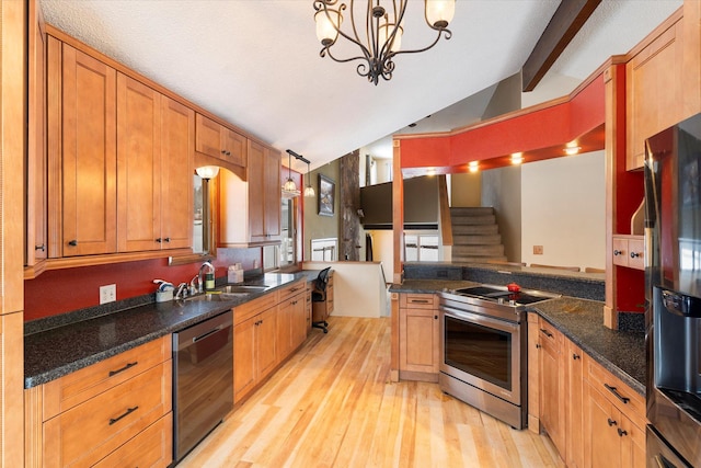 kitchen featuring pendant lighting, stainless steel appliances, sink, and lofted ceiling with beams